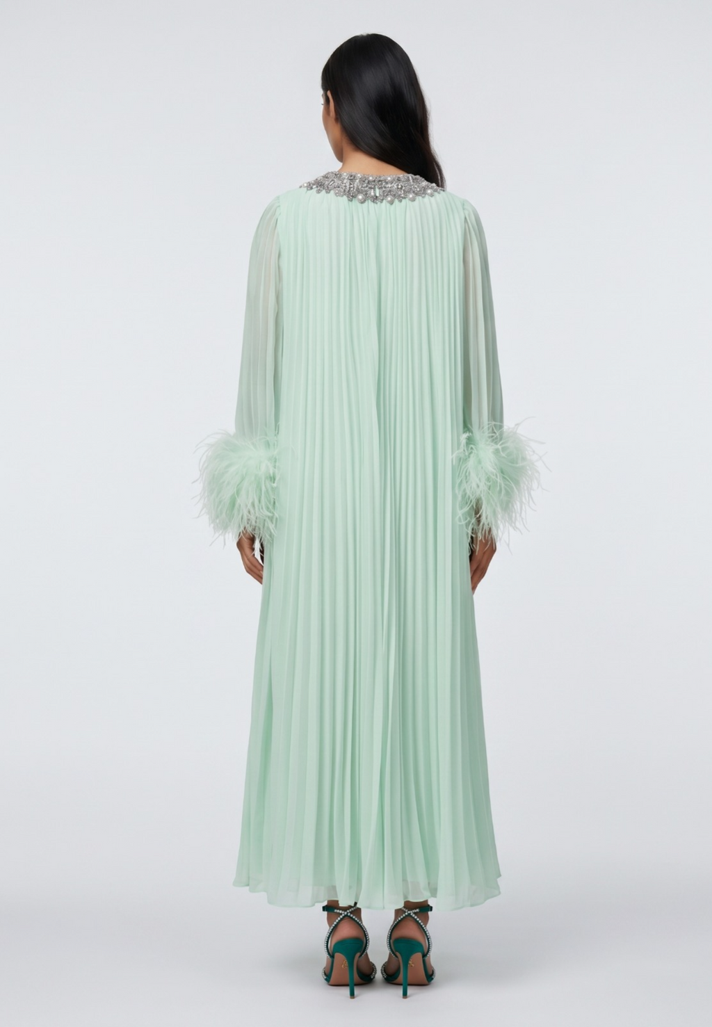 Mint green abaya with embellished neckline and cuffs on a white background