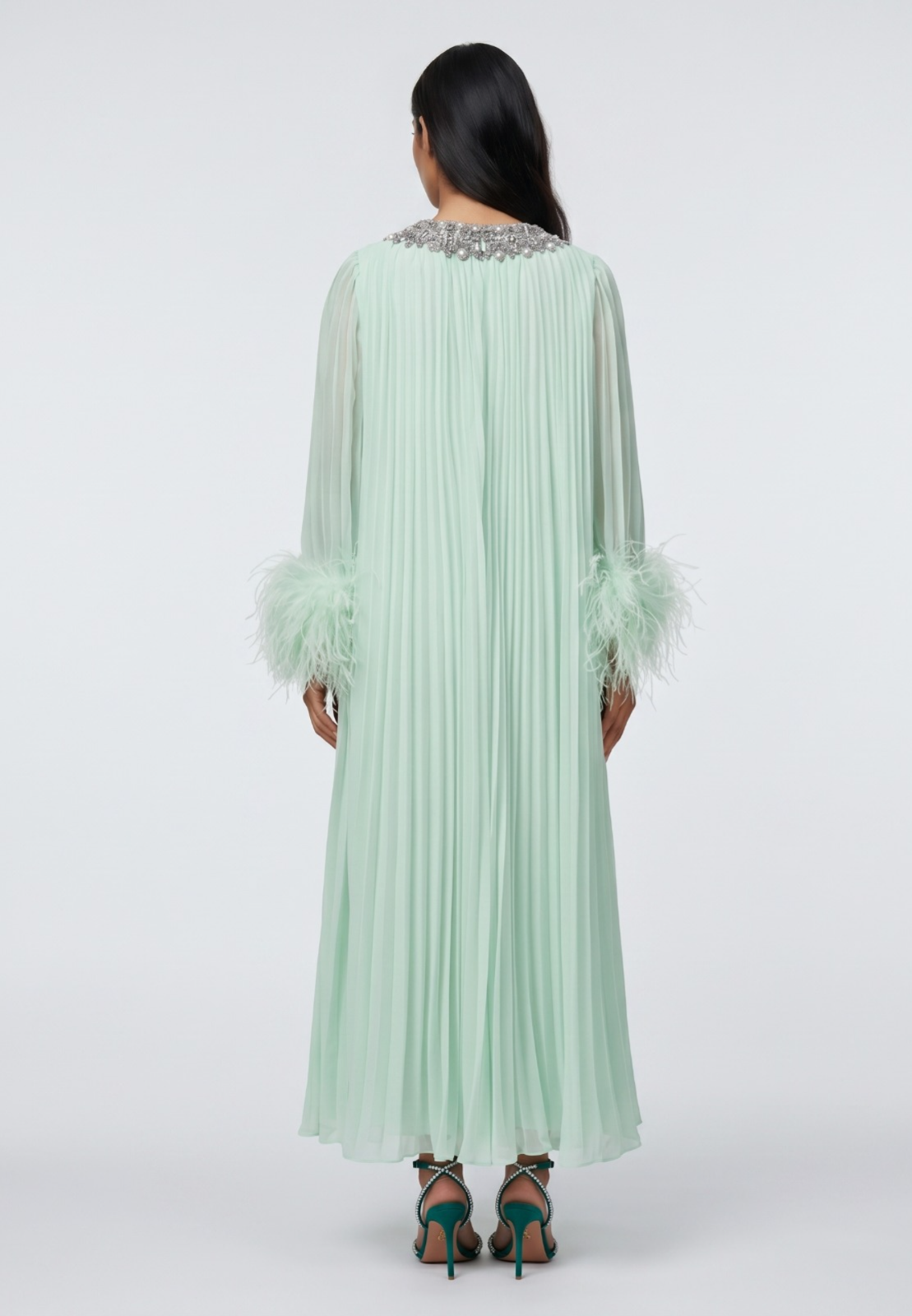 Mint green abaya with embellished neckline and cuffs on a white background
